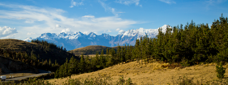 Trekker overlooking Choquequirao ruins with Apurimac canyon backdrop